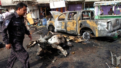 A wave of attacks killed at least  people in Shiite and Sunni areas of Iraq on Monday, officials said, pushing the death toll over the past week to more than  and extending one of the most sustained bouts of sectarian violence the country has seen in years.